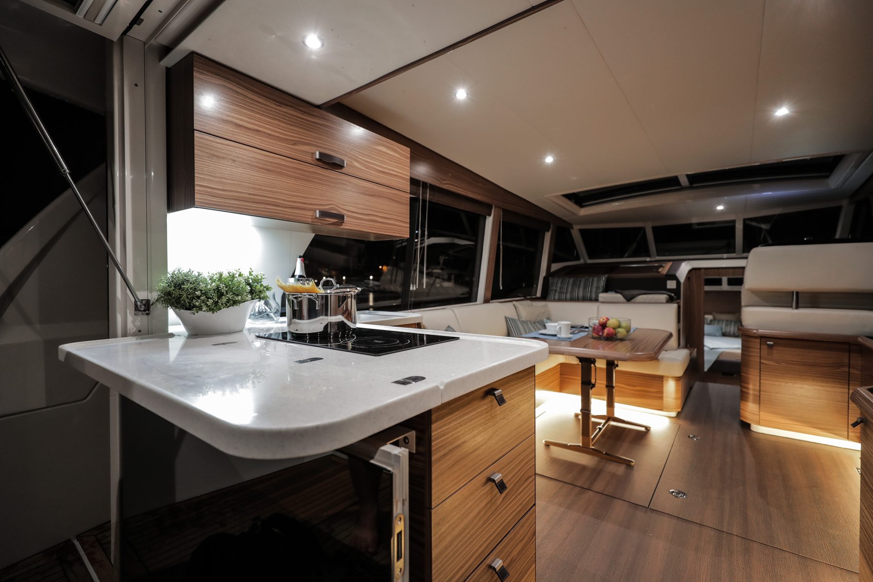 Galley counter at night, salon beyond